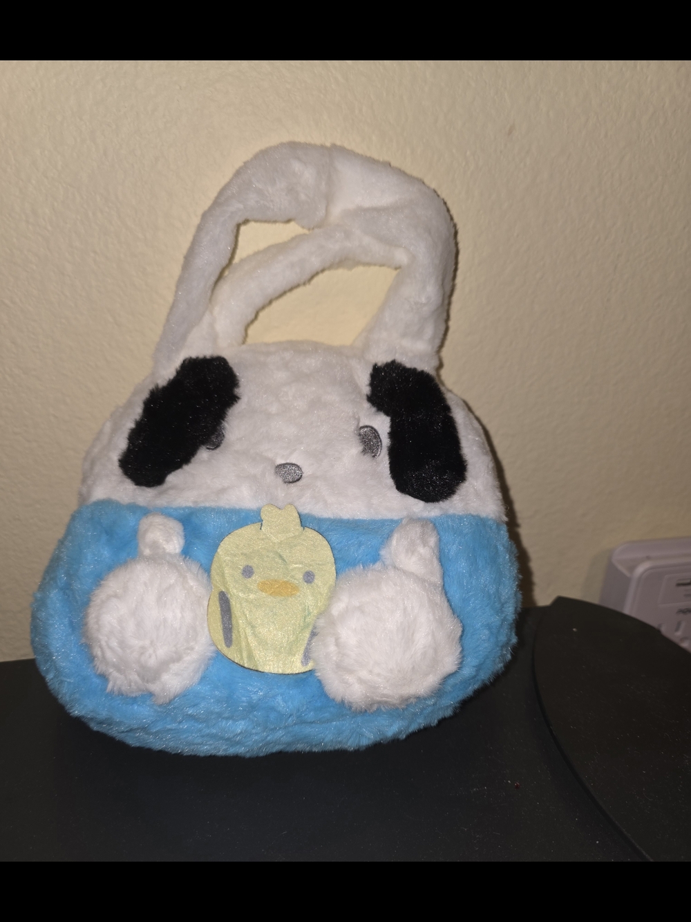 Sanrio Hello Kitty white and blue plush handbag with black ears and a yellow cup